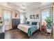 Spacious bedroom with dark dresser and green bedding at 7025 Old Evergreen Pkwy, Indian Trail, NC 28079