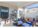 Lovely screened porch with comfy seating and a cat tree at 7025 Old Evergreen Pkwy, Indian Trail, NC 28079