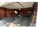 Spacious garage with a work bench, built-in shelving, and a concrete floor at 7401 Kilcullen Dr, Charlotte, NC 28270