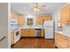 Well-lit kitchen with wood cabinets, white countertops, and stainless steel appliances at 7401 Kilcullen Dr, Charlotte, NC 28270