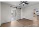 Bedroom with hardwood floors and access to bathroom and kitchen at 809 S Bostian St, China Grove, NC 28023