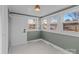 Sunroom features green walls, patterned tile, and multiple windows at 809 S Bostian St, China Grove, NC 28023