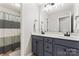 Bathroom with double vanity, large mirror, and a shower/tub combo at 8112 Bramfield Dr # 158, Huntersville, NC 28078