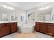 Double vanity bathroom with a soaking tub and tile flooring at 8112 Bramfield Dr # 158, Huntersville, NC 28078