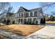 Two-story house with gray siding, white columns, and a manicured lawn at 8112 Bramfield Dr # 158, Huntersville, NC 28078