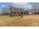 Brick ranch house with a large yard and detached shed at 927 Ferguson Ridge Rd, Gastonia, NC 28052