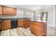 Modern kitchen with dark countertops and wooden cabinets at 9308 Highrock Dr, Waxhaw, NC 28173