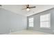 Bedroom with neutral walls and two windows at 1000 Lily Pond Cir, Waxhaw, NC 28173