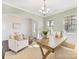 Bright dining room with light walls, hardwood floors, and a wooden desk at 1000 Lily Pond Cir, Waxhaw, NC 28173