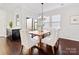 Dining area with hardwood floors and a modern live-edge table at 1000 Lily Pond Cir, Waxhaw, NC 28173