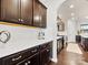 Kitchen features dark cabinetry, quartz countertops, and ample storage at 1000 Lily Pond Cir, Waxhaw, NC 28173