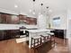 Modern kitchen with dark cabinets, white countertops, and a large island at 1000 Lily Pond Cir, Waxhaw, NC 28173