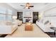 Spacious living room with a fireplace, built-in shelving, and hardwood floors at 1000 Lily Pond Cir, Waxhaw, NC 28173