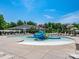 Community pool with a fun water slide and play area for  at 1000 Lily Pond Cir, Waxhaw, NC 28173