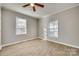 Simple bedroom with hardwood floors and two windows at 105 Linden St, Clover, SC 29710