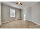 Well-lit bedroom with ceiling fan and wood-look floors at 105 Linden St, Clover, SC 29710