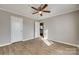 Spacious bedroom with ceiling fan and access to another room at 105 Linden St, Clover, SC 29710