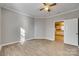 Bright bedroom with wood-look floors and ceiling fan at 105 Linden St, Clover, SC 29710