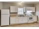 Efficient kitchen with white cabinets and modern appliances at 105 Linden St, Clover, SC 29710