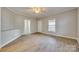 Open living room with hardwood floors and access to the outdoors at 105 Linden St, Clover, SC 29710