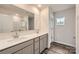 A modern bathroom featuring a double sink vanity with modern cabinets and a large mirror at 1187 Blackburn Cir, Edgemoor, SC 29712