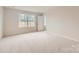 Bedroom featuring neutral walls, carpet flooring, and large windows that let in natural light at 1187 Blackburn Cir, Edgemoor, SC 29712