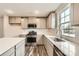 A modern kitchen featuring white cabinets, stainless steel appliances, and a white subway tile backsplash at 1187 Blackburn Cir, Edgemoor, SC 29712