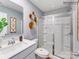 Modern bathroom with glass shower and white vanity at 1189 Blackburn Cir, Edgemoor, SC 29712