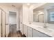 The bathroom has a double sink vanity with a large mirror and a shower with glass doors at 1189 Blackburn Cir, Edgemoor, SC 29712