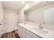 Bathroom featuring double sinks, a large mirror, and a shower-tub combination with updated fixtures at 1189 Blackburn Cir, Edgemoor, SC 29712