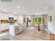 Modern white kitchen with island, stainless steel appliances, and hardwood floors at 1189 Blackburn Cir, Edgemoor, SC 29712