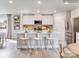 White kitchen with island and stainless steel appliances at 1189 Blackburn Cir, Edgemoor, SC 29712