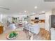 Open concept kitchen and dining area with island and hardwood floors at 1189 Blackburn Cir, Edgemoor, SC 29712