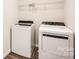 Well-equipped laundry room showcasing a new washer and dryer, along with convenient overhead shelving at 1189 Blackburn Cir, Edgemoor, SC 29712