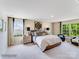 Spacious main bedroom with plush bed and large windows at 1189 Blackburn Cir, Edgemoor, SC 29712