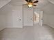 Bright bedroom with multiple closets and access to a loft area at 12064 Spinnaker Dr, Fort Mill, SC 29708