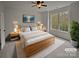 Bright bedroom with a large window and light wood furniture at 12064 Spinnaker Dr, Fort Mill, SC 29708