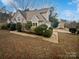 Two-story house with beige siding and landscaping at 12064 Spinnaker Dr, Fort Mill, SC 29708