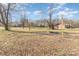 Large lot with mature trees, a firepit and clothesline, and with a rural feel at 1209 Austin Chaney Rd, Wingate, NC 28174