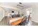 Well-lit dining room with open access to the living room featuring modern light fixture and decor at 1209 Austin Chaney Rd, Wingate, NC 28174