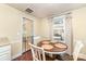 Small dining room with wood floors and table near safety gate at 1209 Austin Chaney Rd, Wingate, NC 28174