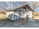 A charming outbuilding with white and black doors which is an extra space for storage at 1209 Austin Chaney Rd, Wingate, NC 28174