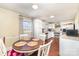 Charming kitchen with white cabinetry, stainless appliances, and a breakfast nook for casual dining at 1209 Austin Chaney Rd, Wingate, NC 28174