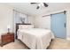 Serene main bedroom with a sliding blue barn door, neutral tones, and ample natural light at 1209 Austin Chaney Rd, Wingate, NC 28174