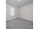 Simple bedroom with gray carpet and a window at 1212 31St Ne St, Conover, NC 28613