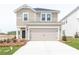 Two-story house with beige siding, a two-car garage, and landscaping at 1212 31St Ne St, Conover, NC 28613