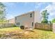 Spacious backyard featuring a patio area, lush lawn, and wood fence at 1219 Century Dr, Clover, SC 29710