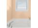 Bathroom with corner bathtub and window with blinds at 1219 Century Dr, Clover, SC 29710