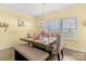 Bright dining room features a wood table, bench seating, and neutral decor at 1219 Century Dr, Clover, SC 29710