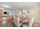 Dining area with a wood table and beige upholstered chairs at 1219 Century Dr, Clover, SC 29710